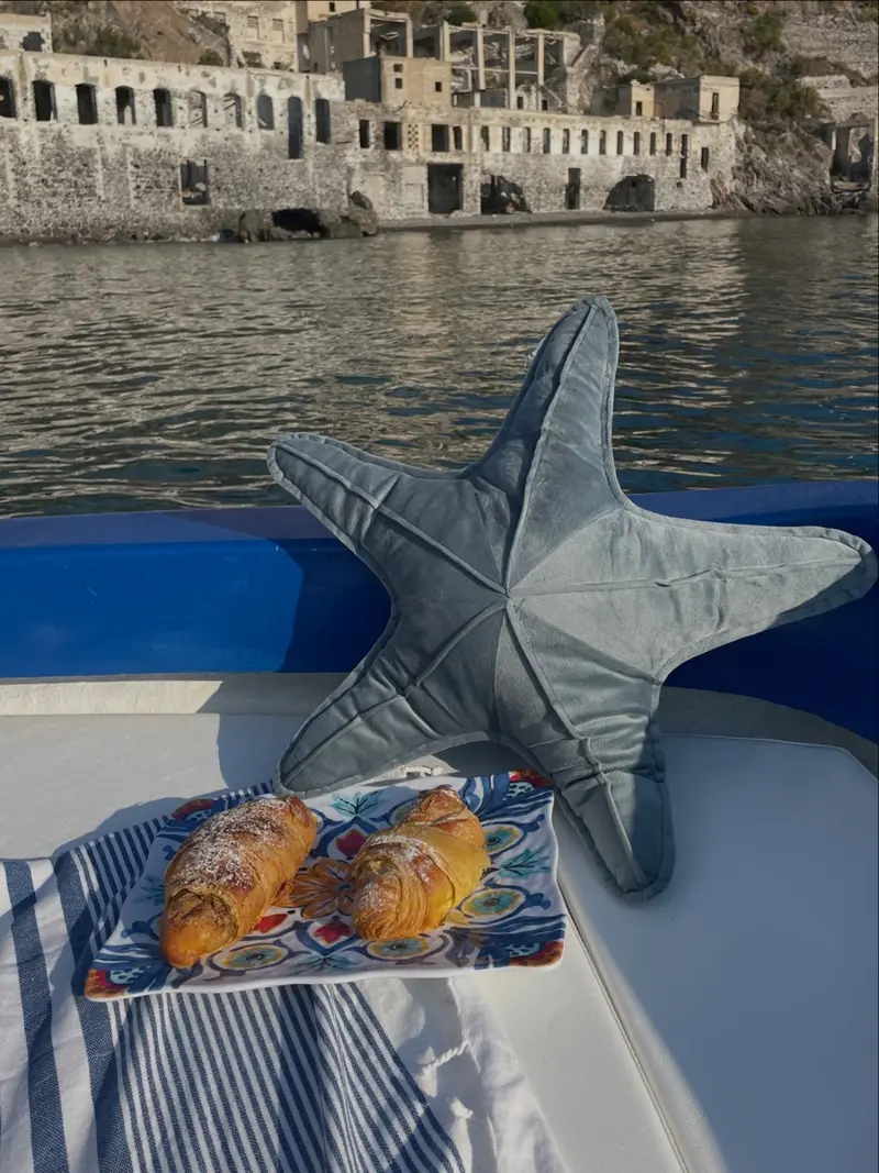 Breakfast on board at sunrise with sea view